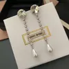 Projektant Miuimiui kolczyki miu kolczyki rodzinne frędzki długie kolczyki Miao Family Drops Pearl 925 Srebrne Temperament Celebryty Ins Ins