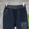 Pantaloni sportivi da uomo Casual traspiranti Pantaloni da uomo stile classico Tasca con distintivo ricamato Pantaloni firmati Pantaloni hip-hop da strada Asiatici S-5XL