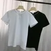 女性のTシャツ女性ウールブレンド高品質ブランドトップ2023夏の新しいパールボウノットビーズネックレスOネックブラックホワイトショートスリーブTシャツカジュアルカジュアル