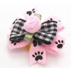 Vêtements de chien 100pc / lot chat cheveux arcs petits accessoires fleurs roses toilettage bandes de caoutchouc 328c