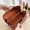 Sacs à cosmétiques Trousse de toilette portable en cuir PU avec poignée et séparateurs Rangement multifonctionnel Fermeture à glissière pour femmes Accès facile