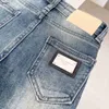 Brand Baby Washed Dżinsy jeansowe Designer dżinsowe spodnie rozmiar 110-150 metalowa dekoracja ozdobna dziecięce spodnie 24MAR