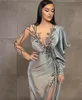 2024 Silver Sheath Long Sleeves Evening Dresses Wear Illusion Crystal Beading High Side Split Floor Length Party Dress Prom Gowns Open Back Robes De Soiree