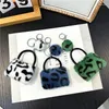 Keychains 100st/mycket Vacker metall leopard tryckväska Keyrings Creative Zinc Alloy for Gift