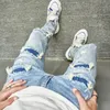 Mężczyźni dziury swobodny chude dżinsy spodnie streetwear męski stylowy rozryte solidne hip hop Slim Denim Spodni 240311