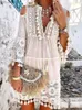 Robes décontractées de base Nouveau printemps broderie Crochet dentelle Boho robe femmes élégant hors épaule gland à volants Mini robe été col en V dame plage robe L2403