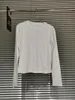 Camicette da donna Camicia alla moda di nicchia aderente e con fondo dimagrante Top T-shirt pullover girocollo versatile alla moda per le donne