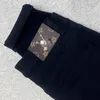 パープルブランドの男性デザイナージーンズストリートプリントパッチワークフレア刺繍スリムフィットハイストリートジーンズ