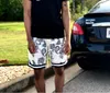 デザイナーの男性ショーツ新しい夏のファッションヒップホップルーズカジュアルバスケットボールプリントフラワー5クォーターパンツ