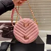 Nuova borsa di design di alta qualità Donna Borsa rotonda piccola Borsa a tracolla di lusso stile caviale Borsa a catena Grande capacità Pelle di mucca Superficie granata Borsa a tracolla a tracolla