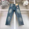 Brand Baby Washed Dżinsy jeansowe Designer dżinsowe spodnie rozmiar 110-150 metalowa dekoracja ozdobna dziecięce spodnie 24MAR