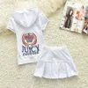 2024 Summer Juicy New Short Sleeved Pure Cotton Top och kjol Casual Sports Set med paljettkvinnors korta kjoluppsättning