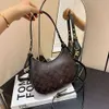 Borse alla moda dei migliori designer Borse dei migliori designer Borsa da donna Nuova tracolla singola a tracolla con trama rossa in rete Crcent alla moda e versatile