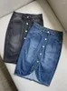 Jupes Jupe en jean à simple boutonnage pour femmes couleur unie fente coton taille haute mode féminine Mini Jupe 2024 automne