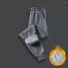 Pantalons pour hommes, vêtements surdimensionnés polyvalents, tendance automne et hiver 2024, poches d'épissure avec cordon de serrage, mode couleur unie, peluche