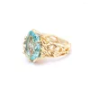 Med sidogenar Seanlov ihålig guldfärg kvinnliga ringar banade stora ljusblå cz zirkon lyxig gåva smycken finger ogräsande förlovningsring