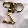 Designer Luxury Designer Keychain Fashion Letter Form Pendant Keychains Fashion Gold Keys Buckle Mens Womens Bag Ornament High Quality EN88