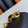 Designer crossbody bag with Chain Woman Twist Tote bags eather small square Designers bag Metal long V shaped buckle Simple fashion very nice gitt purse 23CM