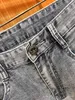 Jeans firmati da uomo Pantaloni da uomo europei da uomo Ricamo motociclistico Jeans moda in cotone strappato pop Pantaloni cargo da uomo Taglia anca nera 28-40 # 034