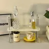 INS même modèle Étagère de table Étagère de parfum en acrylique à trois couches Étagère de tasse moderne simple de haut niveau Décor d'armoire de tri de dessus de table 240309