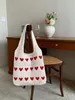 Designer de lã tricô bolsas verão novo mão-tecido sacos de praia multi-cores sacola amor coração padrão bolsa feminina moda sacola oco para fora bolsa de compras