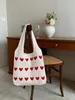 Sacs à main en tricot de laine de créateur Été Nouveaux sacs de plage tissés à la main Sac fourre-tout multi-couleurs Sac à main à motif de coeur d'amour Sac fourre-tout de mode pour femmes Sac à main de shopping ajouré Beige