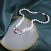 New Western Empress Dowager Saturn Necklace Womens Handmade Knot Colored Painting with Diamond Pearl High end and Unique collarbone Chain