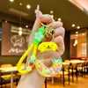 2024 Leuke roze donuts drijfzand fles sleutelhanger acryl olie gevulde rugzakken auto cartoon sleutelhangers groothandel