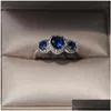 Pierścionki ślubne Klasyczna biżuteria koktajlowa 925 Sterling Sier Three Stone Blue Sapphire CZ Diamond Schły Gemstones Party Women Ban Ban DH63E