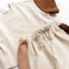 2023ニューサマーカジュアルTシャツ韓国の男の子と女の子半袖半身式新生児ファッションコントラストカラー二枚のベビーセット240315
