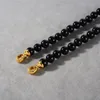 Nouveau style Instagram simple collier d'agate noire plaqué cuivre 18 carats véritable or léger de luxe de haute qualité rétro chaîne de collier de perles rondes pour les femmes