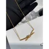 Designer Gu Ailings Cross Knot Necklace with the Same Style for Womens Light Luxury and Unique Design a High Grade Gold Elegance Celebrity Collar Chain