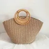 2023 New Handheld Grass Woven Bag Simplified Forest Series Woven Women's Bag Vacation Bag Versatile Fashion Trendy Bag 240315