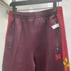 Pantaloni da uomo uomini e donne aghi farfalla il lato ricamato ricamato tasche rosso scuro tasche di alta qualità