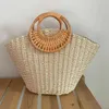2023 New Handheld Grass Woven Bag Simplified Forest Series Woven Women's Bag Vacation Bag Versatile Fashion Trendy Bag 240315