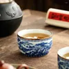 Tazze Piattini Jingdezhen-Tazza blu e bianca dipinta a mano intarsiata con set da tè in ceramica dorata Ciotola di fascia alta