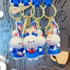 Designer nyckelringar lanyards grossistnyckel BUCKLE BAG CAR HANDMADE MAN KVINNA ÄLSKAR PURSE PAGS PVC CREATIVITY CARTOON VIT Rabbit Rolls Doll Pendant Accessories YSK