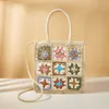 2023 New Fashion and Creative Multicolor Flower Splicing Woven Grass Bag Single Shoulder Handheld Checkered Forest Resort Bag 240315