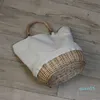 Sac tissé en rotin d'épissage de tissu de chanvre tissé d'herbe, sac tissé en tissu de chanvre tenu dans la main, tenu dans la main