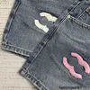 Jeans da donna Versione alta Xiaoxiang 24 jeans e pantaloncini a vita alta floccati rosa alla moda di fascia alta all'inizio della primavera in due colori KJOQ