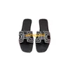 Oran Sandals sommarläder tofflor 2024 Ny koreansk version Rhinestone Flat Bottomed tofflor för kvinnans sommarkläder avslappnade tofflor med L har logotyp hbuh6p