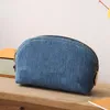 Nouveau 2024 Designer Pochette Denim Pochette Sac à main en toile de coton Rivets dorés Doublure textile lavable Ouverture zippée Sac cosmétique de mode