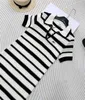 Basic & Casual Dresses designer 2024 early spring new Nanyou Miu Academy style sweet and age reducing hollow out contrasting striped lapel short sleeved dress TNB9