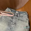 Sommardamer gör gamla denim bokstavs klistermärke hög midja kort kjol, denim tyg har form inte boll, med bälte, smal version av fritidsmode.