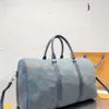 Top 5A Luxurys Bolsas de mezclilla Diseñador Bolsa de viaje Bolsos Bolso de mano Mujer y hombre Nueva textura de moda Multifuncional Portátil Bolsas de compras de gran capacidad