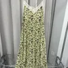 Casual Dresses Yellow Sling Dress Women spets sömmar blommor tryckt viskos ärmlös V-ringning kvinnlig oregelbunden midi mantel vår sommar