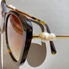 A049 Designer Fashion Ladies Luxury Cool Sunglasses Super High Quality Star Same Pearl Leg Sunglasses with Logo Box Cat Eye