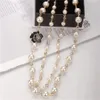 Collana lunga Donna Moda temperamento Fiori in lega esagerata collana di perle accessori di abbigliamento Regalo di Natale