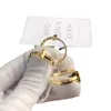 T Diseñador Pareja de acero T Boda Romántico Clásico Inoxidable Amor Regalo Chapado en oro Caja de anillo Embalaje Mujeres Boutique Joyería GG GG