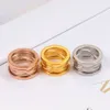 Top Quality Stainless Steel Hollow out Spring ring Women Designer Roman numerals Rose Colors Lover engagement Fashion Couple Jewel243C